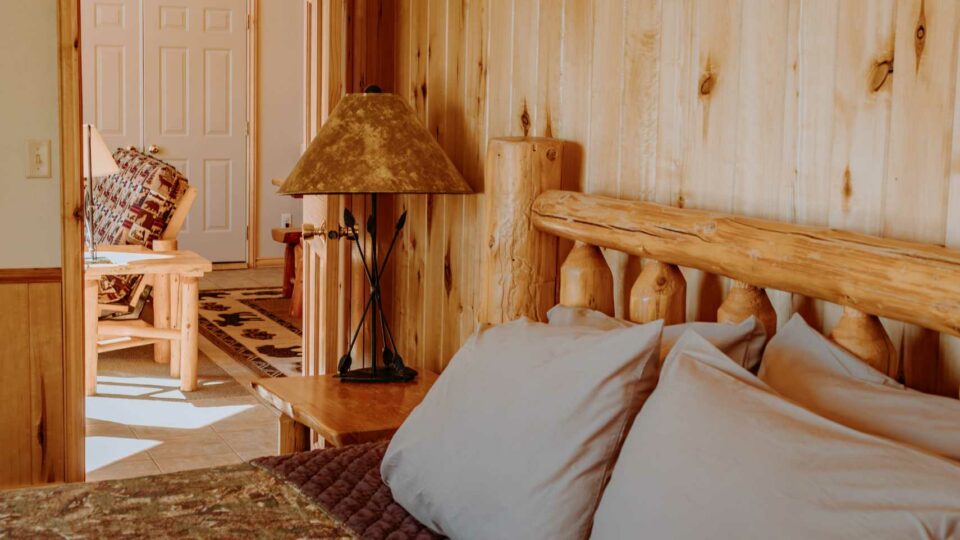 King Bedroom and living room in a cabin rental at a Minnesota Lakefront Resort.