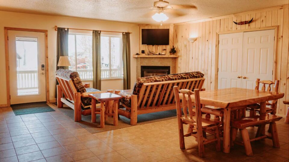 Dining and living room in a cabin rental in Bemidji, Minnesota.