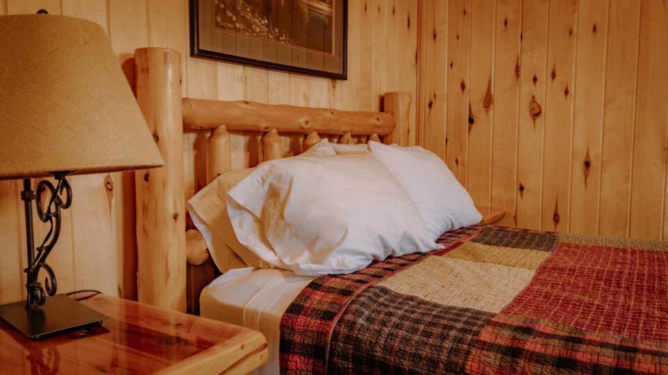 Queen bedroom in a cabin rental at a Family Resort.