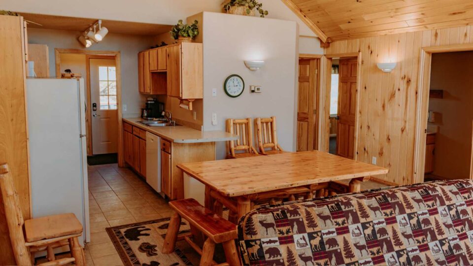 Kitchen and dining in a cabin rental at a family resort in Minnesota.