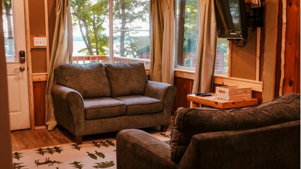 Living room with couches in a cabin rental at Kohl's Resort.